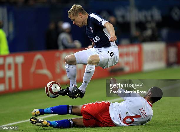 Damien Duff of Fulham plays the ball over Dennis Aogo of HSV during the UEFA Europa League semi final first leg match between Hamburger SV and Fulham...