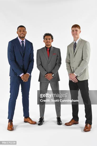 Omari Spellman, Trae Young and Kevin Huerter of the Atlanta Hawks pose for a portrait after an introductory press conference on June 25, 2018 at...
