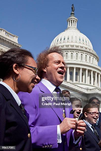 Richard Simmons sings with a choir after the passage of the Fitness Integrated with Teaching Kids Act at the US Capitol on April 22, 2010 in...