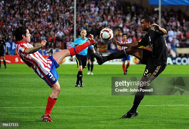 David N'Gog of Liverpool competes with Antonio Loez of Athletico Madrid during the UEFA Europa League Semi-Finals First Leg match between Atletico...