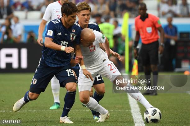 Japan's defender Hiroki Sakai vies with Poland's midfielder Rafal Kurzawa past Japan's defender Gotoku Sakai during the Russia 2018 World Cup Group H...