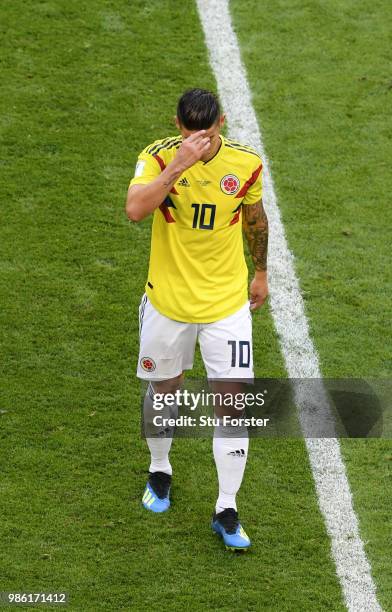 James Rodriguez of Colombia looks dejected as he is substituted off due to injury during the 2018 FIFA World Cup Russia group H match between Senegal...