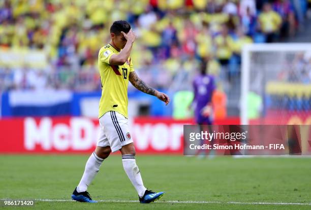 James Rodriguez of Colombia looks dejected as he is substituted off due to injury during the 2018 FIFA World Cup Russia group H match between Senegal...