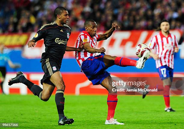 Luis Amaranto Perea of Atletico Madrid clears the ball from David N'Gog of Liverpool during the UEFA Europa League Semi Final first leg match between...