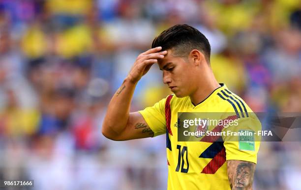 James Rodriguez of Colombia looks dejected as he is substituted off due to injury during the 2018 FIFA World Cup Russia group H match between Senegal...