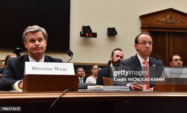 Director Christopher Wray and Deputy Attorney General Rod Rosenstein arrive to testify before a congressional House Judiciary Committee hearing on...