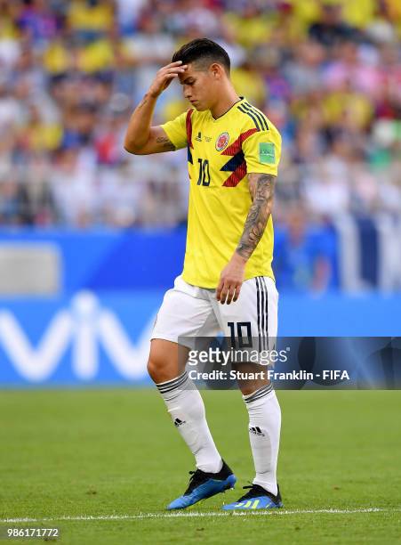 James Rodriguez of Colombia looks dejected as he is substituted off due to injury during the 2018 FIFA World Cup Russia group H match between Senegal...