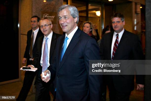 Jamie Dimon, chairman and chief executive officer of JPMorgan Chase & Co., exits the Fairmont Chicago hotel after a luncheon speech in Chicago,...