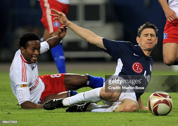Ze Roberto of HSV challenges Zoltan Gera of Fulham during the UEFA Europa League semi final first leg match between Hamburger SV and Fulham at HSH...