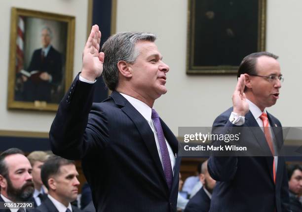 Director Christopher Wray and U.S. Deputy Attorney General Rod Rosenstein are sworn in while appearing before the House Judiciary Committee June 28,...