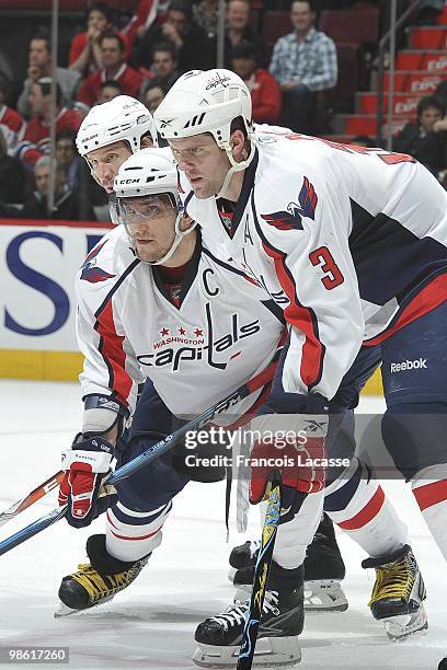 Alex Ovechkin of the Washington Capitals waits for a face off with teammate Tom Poti and Mike Knuble in the Game Three of the Eastern Conference...