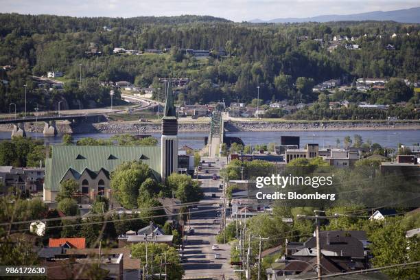 Traffic moves along a street in the Chicoutimi borough of Saguenay, Quebec, Canada, on Thursday, June 21, 2018. This picturesque corner of...