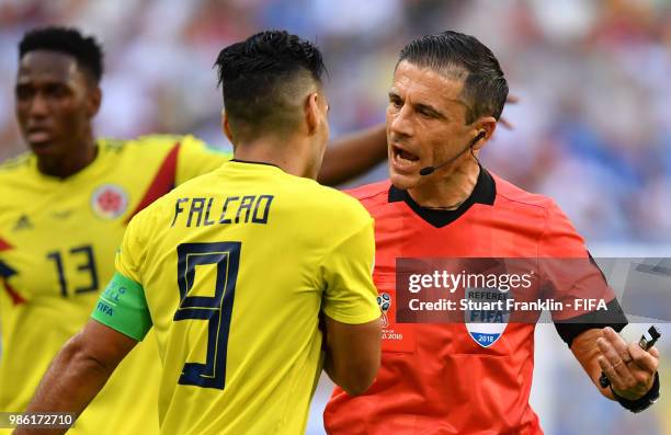 Referee Milorad Mazic speaks with Radamel Falcao of Colombia during the 2018 FIFA World Cup Russia group H match between Senegal and Colombia at...