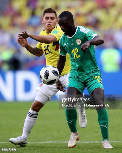 Youssouf Sabaly of Senegal is challenged by Keita Balde of Senegal during the 2018 FIFA World Cup Russia group H match between Senegal and Colombia...