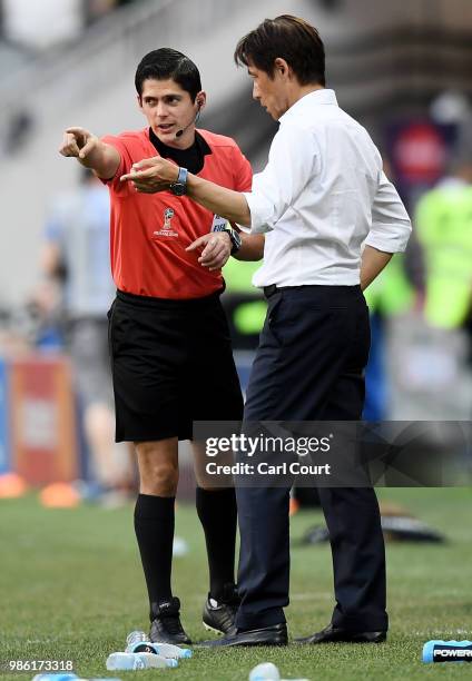 Akira Nishino, Manager of Japan talk to the fourth official Ricardo Montero during the 2018 FIFA World Cup Russia group H match between Japan and...