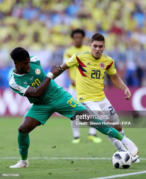 Keita Balde of Senegal is challenged by Juan Quintero of Colombia during the 2018 FIFA World Cup Russia group H match between Senegal and Colombia at...