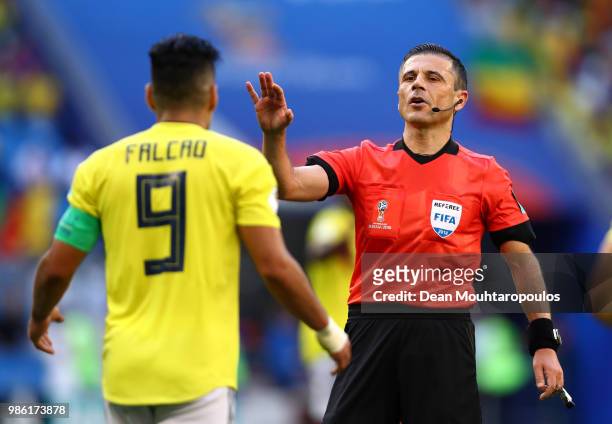 Referee Milorad Mazic speaks with Radamel Falcao of Colombia during the 2018 FIFA World Cup Russia group H match between Senegal and Colombia at...