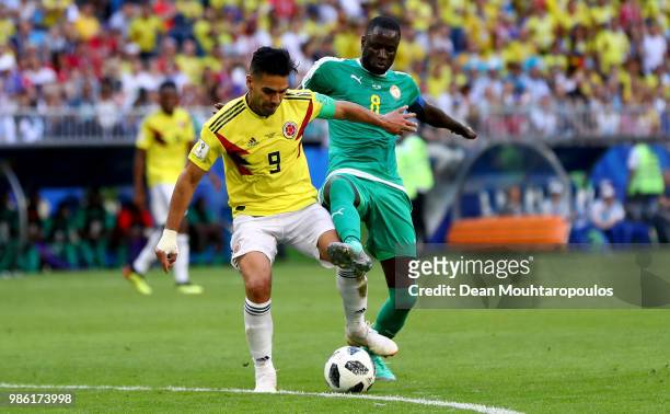 Radamel Falcao of Colombia is challenged by Cheikhou Kouyate of Senegal during the 2018 FIFA World Cup Russia group H match between Senegal and...