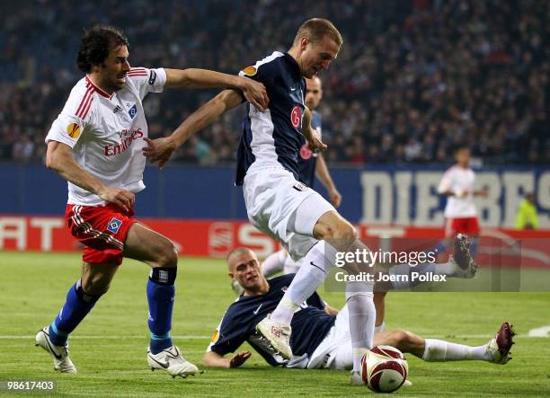 Ruud van Nistelrooy of Hamburg and Brede Hangeland of Fulham compete for the ball during the UEFA Europa League semi final first leg match between...