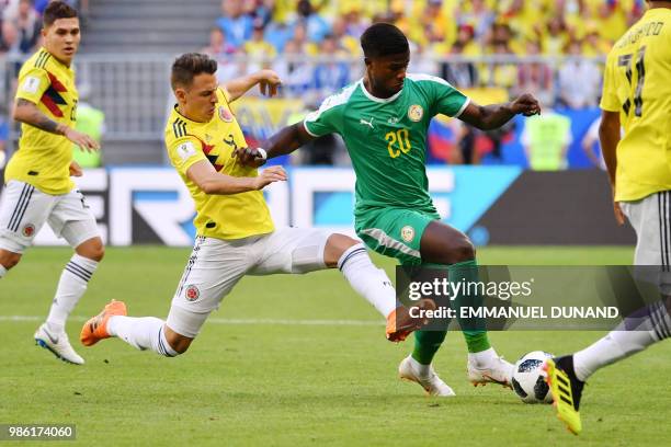 Colombia's defender Santiago Arias challenges Senegal's forward Keita Balde during the Russia 2018 World Cup Group H football match between Senegal...