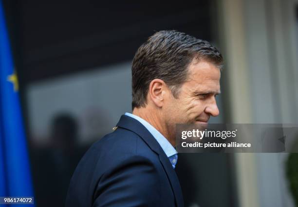 June 2018, Germany, Frankfurt am Main: Oliver Bierhoff, business manager of the Germany football team, leaves after a press statement in the VIP area...