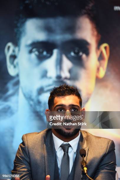 Amir Khan talks to the media during a Press Conference ahead of his fight against Samuel Vargas at Barclaycard Arena on June 28, 2018 in Birmingham,...