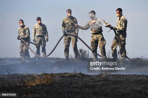 Soldiers from 4th Battalion Royal Regiment Scotland tackle wildfires near Swineshaw reservoir in Stalybridge on June 28, 2018 in Stalybridge,...