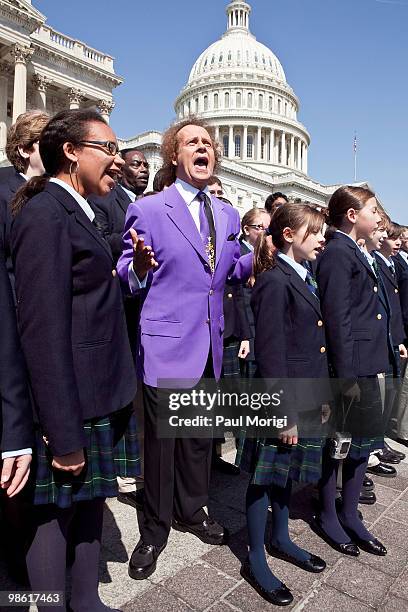 Richard Simmons sings with a choir after the passage of the Fitness Integrated with Teaching Kids Act at the US Capitol on April 22, 2010 in...