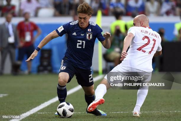 Japan's defender Gotoku Sakai vies with Poland's midfielder Rafal Kurzawa during the Russia 2018 World Cup Group H football match between Japan and...