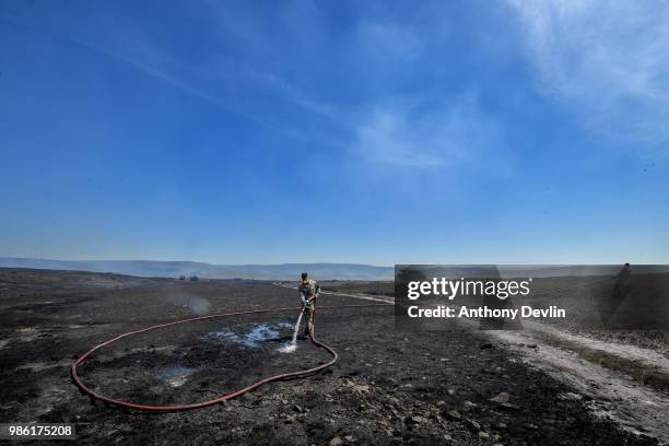 Soldiers from 4th Battalion Royal Regiment Scotland tackle wildfires near Swineshaw reservoir in Stalybridge on June 28, 2018 in Stalybridge,...