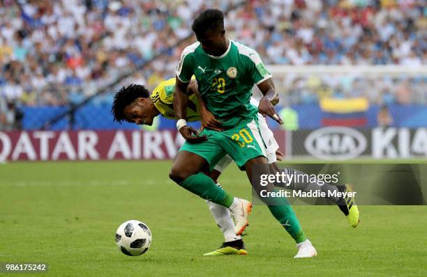 Keita Balde of Senegal is challenged by Juan Cuadrado of Colombia during the 2018 FIFA World Cup Russia group H match between Senegal and Colombia at...