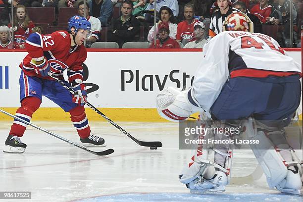 Dominic Moore of the Montreal Canadiens takes a shot on goalie Semyon Varlamov of the Washington Capitals in the Game Three of the Eastern Conference...
