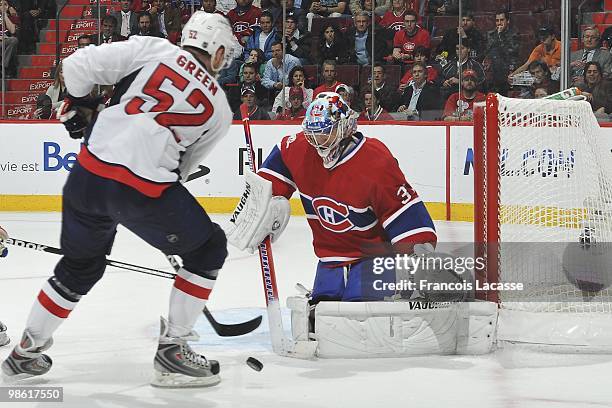 Mike Green of the Washington Capitals takes a shot on goalie Carey Price of Montreal Canadiens in the Game Three of the Eastern Conference...