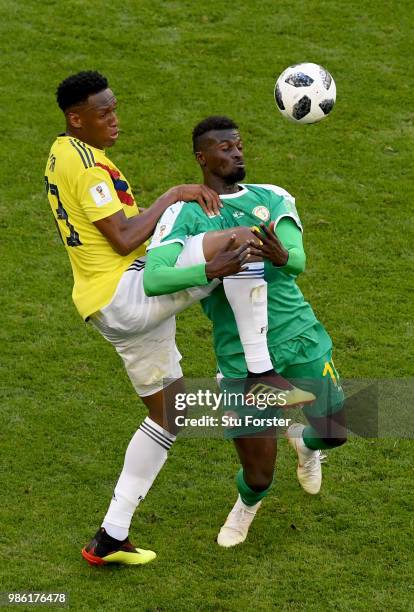 Mbaye Niang of Senegal is challenged by Yerry Mina of Colombia during the 2018 FIFA World Cup Russia group H match between Senegal and Colombia at...