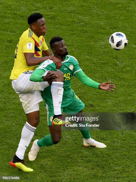 Mbaye Niang of Senegal is challenged by Yerry Mina of Colombia during the 2018 FIFA World Cup Russia group H match between Senegal and Colombia at...