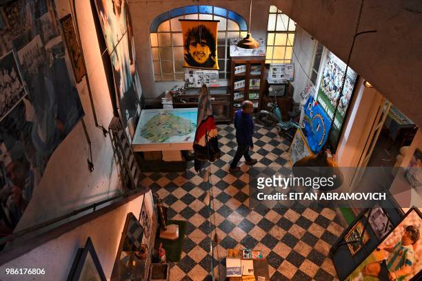 Memorabilia objects are displayed at the 'Casa de Dios' museum in Buenos Aires, on June 27, 2018. - 'Casa de Dios' is located at the house where...