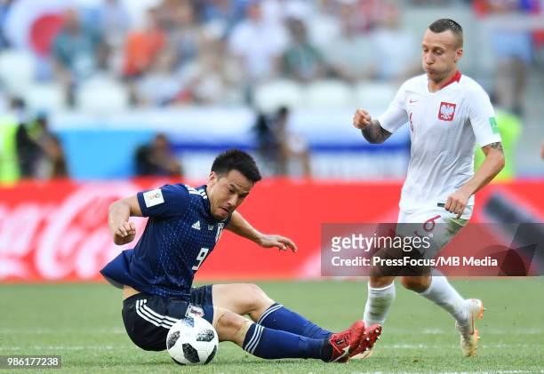 Shinji Okazaki of Japan competes with Jacek Goralski of Poland during the 2018 FIFA World Cup Russia group H match between Japan and Poland at...