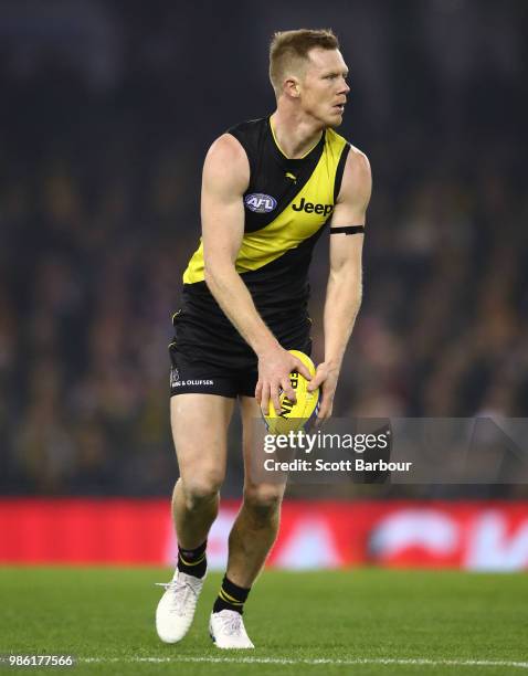 Jack Riewoldt of the Tigers runs with the ball during the round 15 AFL match between the Richmond Tigers and the Sydney Swans at Etihad Stadium on...