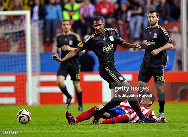 David Ngog of Liverpool competes with Jose Antonio Reyes of Athletico Madrid during the UEFA Europa League Semi-Finals First Leg match between...