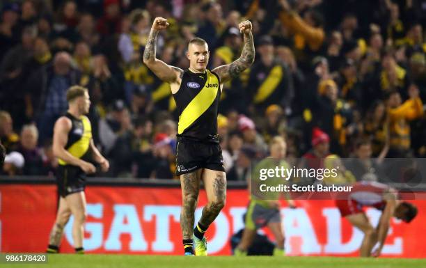 Dustin Martin of the Tigers celebrates at the full time siren and winning the round 15 AFL match between the Richmond Tigers and the Sydney Swans at...