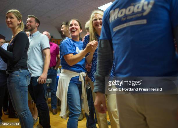 Denise Kaserman, left, of Falmouth and Karen Vachon of Scarborough reacts as favorable primary voting results are reported at a gathering at for...