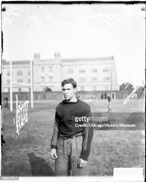 Informal three-quarter length portrait of University of Chicago football player Kuh standing on the field at Marshall Field , which was located at...