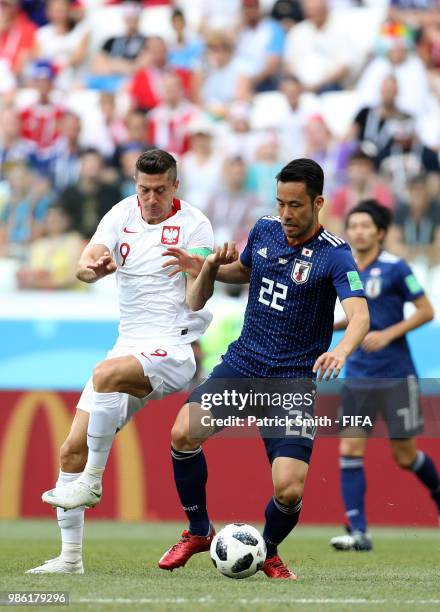 Maya Yoshida of Japan and Robert Lewandowski of Poland compete for the ball during the 2018 FIFA World Cup Russia group H match between Japan and...