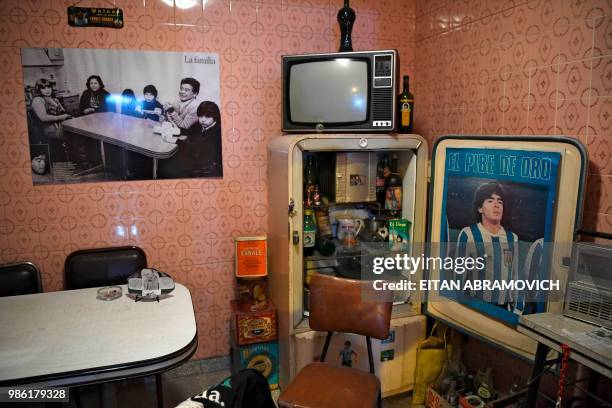 Memorabilia objects are displayed at the 'Casa de Dios' museum in Buenos Aires, on June 27, 2018. - 'Casa de Dios' is located at the house where...