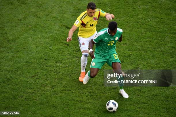 Senegal's forward Keita Balde vies for the ball with Colombia's defender Santiago Arias during the Russia 2018 World Cup Group H football match...