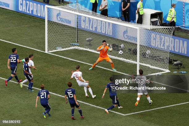Jan Bednarek of Poland scores past Eiji Kawashima of Japan his team's first goal during the 2018 FIFA World Cup Russia group H match between Japan...