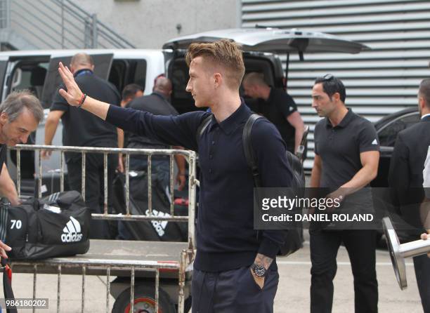 Germany's forward Marco Reus arrives at Frankfurt international airport on June 28 after flying back from Moscow following the German national...