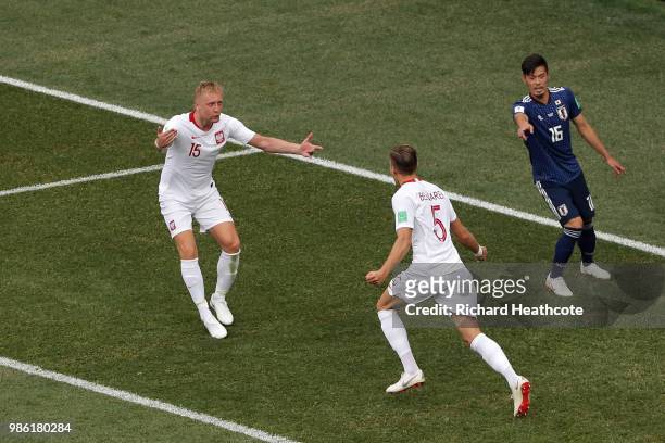 Jan Bednarek of Poland celebrates with teammate Kamil Glik after scoring his team's first goal during the 2018 FIFA World Cup Russia group H match...
