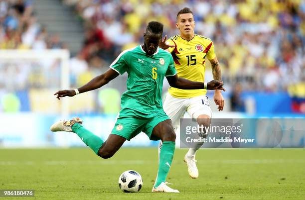 Salif Sane of Senegal plays the ball under pressure from Mateus Uribe of Colombia during the 2018 FIFA World Cup Russia group H match between Senegal...