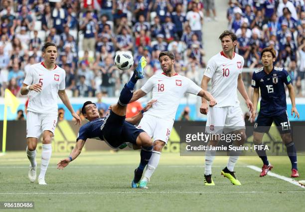 Tomoaki Makino of Japan attempts an overhead kick during the 2018 FIFA World Cup Russia group H match between Japan and Poland at Volgograd Arena on...